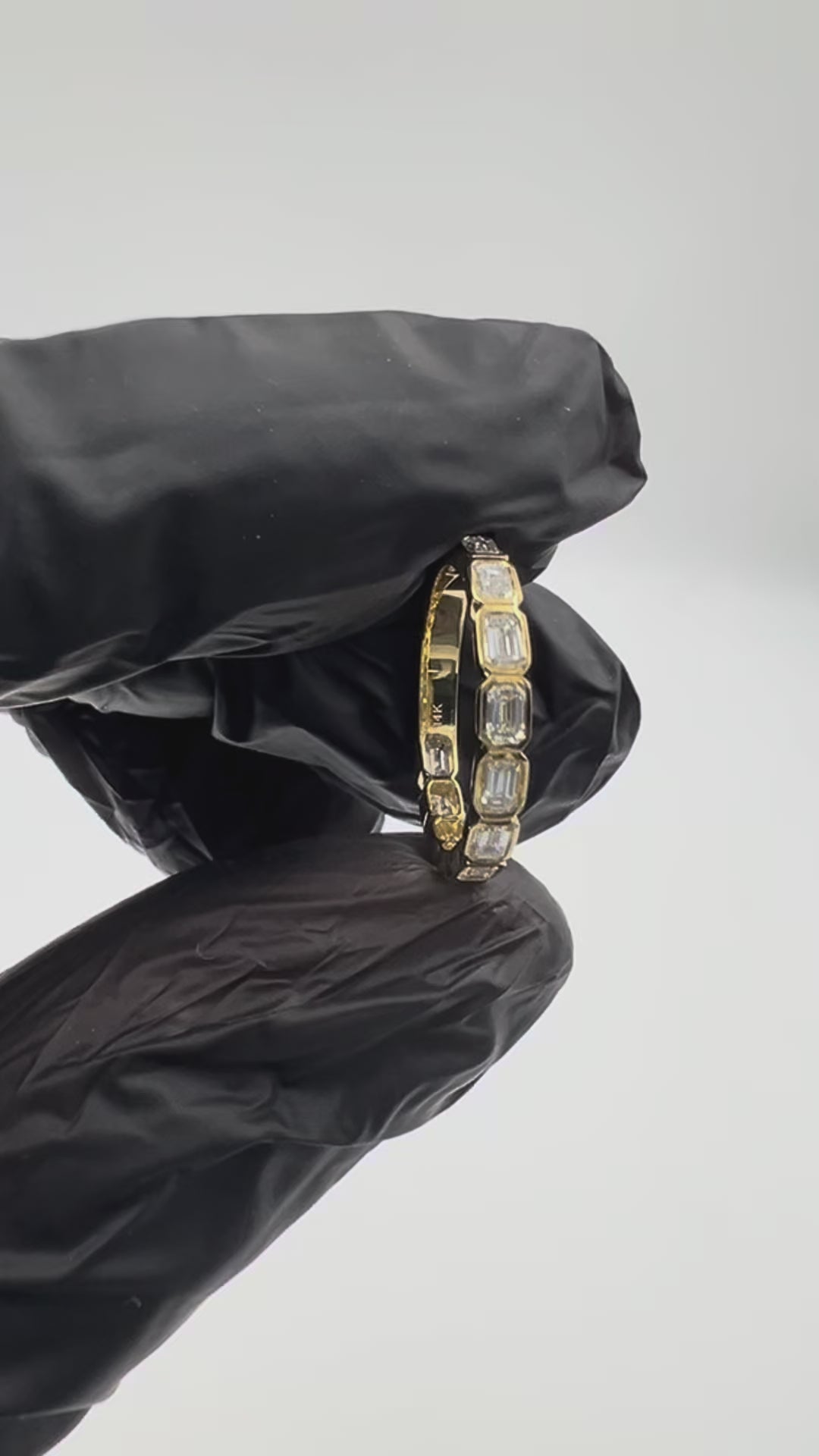 1.00CT EMERALD EAST WEST BEZEL SET 3/4 ETERNITY BAND